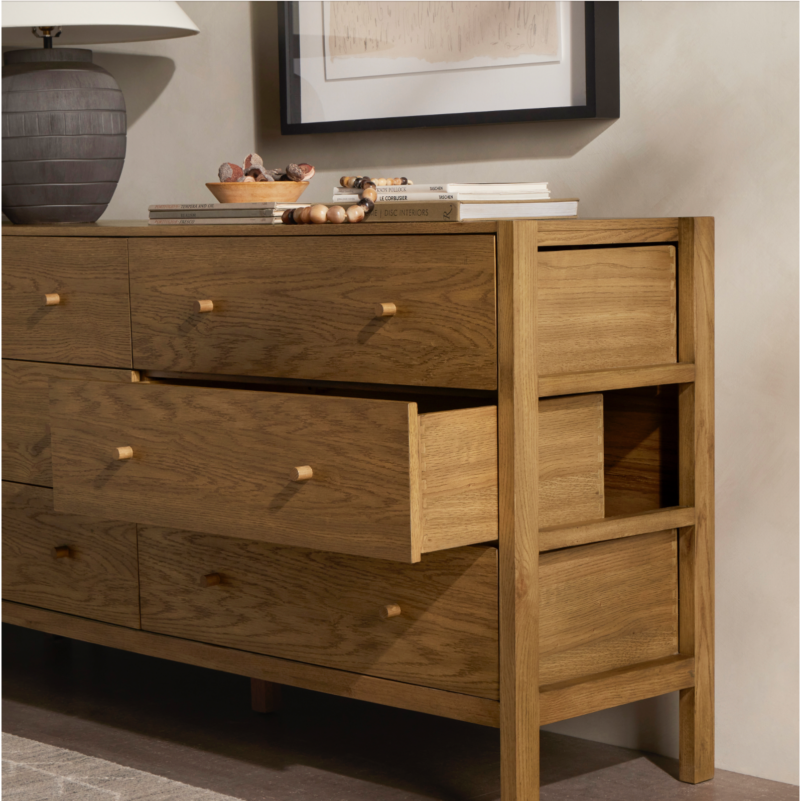 Featuring Meadow Tawny Oak 6 Drawer Dresser by Four Hands at Amethyst Home. With simple shaping inspired by midcentury casing, exposed framework and a warm oak finish bring a handcrafted, minimalist look to modern bedroom styling, with six spacious drawers for ample storage.
Overall Dimensions: 68.75"W x 17.50"L x 34.25"HColors: Tawny Oak Veneer, Tawny OakMater. Amethyst Home provides interior design, new home construction design consulting, vintage area rugs, and lighting in the Tempe metro area.