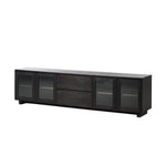 Featuring Toni Worn Black Oak Media Console by Four Hands at Amethyst Home. Grand-scale with a wide, low profile. Glass doors bookend central wood drawers, balancing display and concealed storage. Worn black finish highlights clean lines, anchoring modern spaces with understated impact.Overall Dimensions: 92.00"w x 17.00"d x 24.00"hWeight : 179.90 lbsMaterials : Solid Oak, Thick. Amethyst Home provides interior design, new construction, custom furniture, and area rugs in the Kansas City metro area