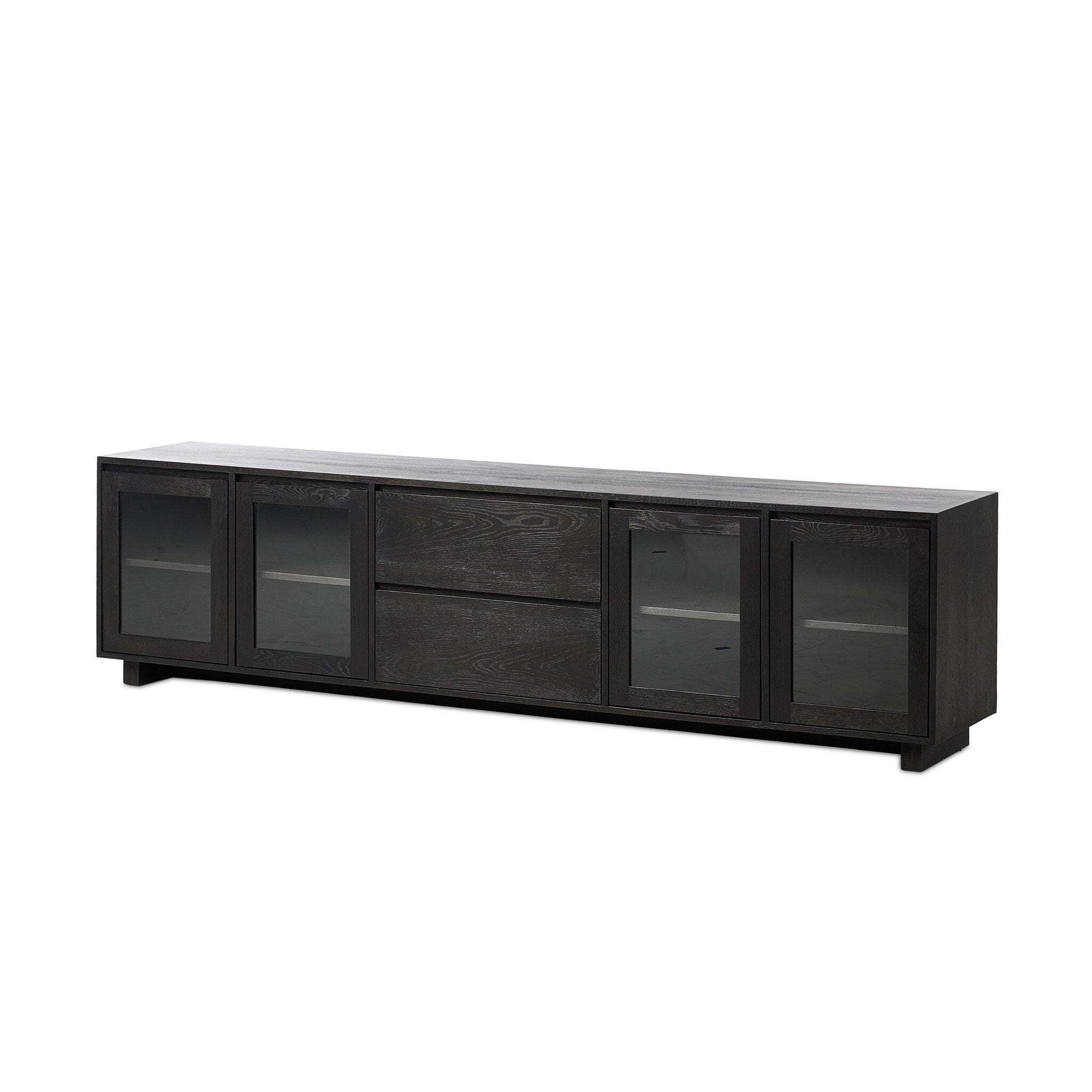 Featuring Toni Worn Black Oak Media Console by Four Hands at Amethyst Home. Grand-scale with a wide, low profile. Glass doors bookend central wood drawers, balancing display and concealed storage. Worn black finish highlights clean lines, anchoring modern spaces with understated impact.Overall Dimensions: 92.00"w x 17.00"d x 24.00"hWeight : 179.90 lbsMaterials : Solid Oak, Thick. Amethyst Home provides interior design, new construction, custom furniture, and area rugs in the Kansas City metro area