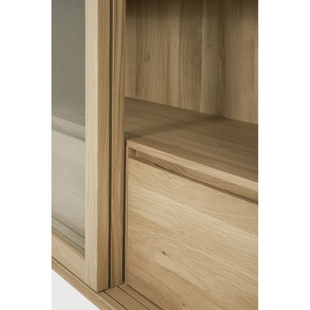 Featuring Wave Oak Cupboard by Ethnicraft at Amethyst Home. The subtle contours of the cabinet doors and the distinguished shape of the feet are what make the Wave collection so special. Made of solid wood, this storage cupboard’s doors and drawers have no handles and feature a soft closing mechanism.Weight : 256 lbs Dimensions: 18.5" W x 43.5" L x 72.5" H. Amethyst Home provides interior design, new construction, custom furniture, and area rugs in the Charlotte metro area