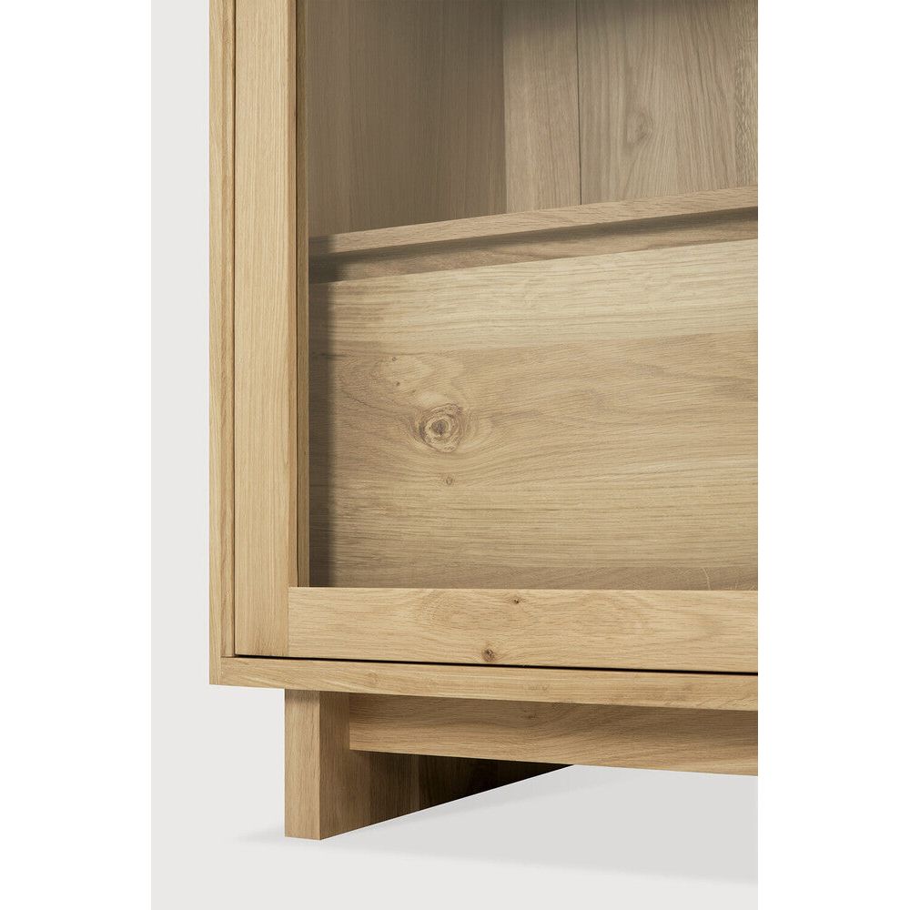 Featuring Wave Oak Cupboard by Ethnicraft at Amethyst Home. The subtle contours of the cabinet doors and the distinguished shape of the feet are what make the Wave collection so special. Made of solid wood, this storage cupboard’s doors and drawers have no handles and feature a soft closing mechanism.Weight : 256 lbs Dimensions: 18.5" W x 43.5" L x 72.5" H. Amethyst Home provides interior design, new construction, custom furniture, and area rugs in the Winter Garden metro area