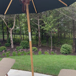 Inspired by the packable nature of 1800s campaign-style pieces, this outdoor umbrella features a teak pole and black canopy operated by a pulley system. Leather detailing and a woven rope cord offer subtle yet sophisticated finishes. Base sold separately. Cover or store indoors during inclement weather and when not in use.Overall Dimensions: 118.00"w x 118. Amethyst Home provides interior design, new home construction design consulting, vintage area rugs, and lighting in the Salt Lake City metro area.