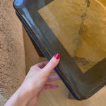 An airy, angular base of charcoal-burnished iron supports a squared tabletop of amber cast glass, perfectly sized to keep your drink or book within reach.Overall Dimensions: 12.50"w x 12.50"d x 22.00"hWeight : 36.38 lbsMaterials : Cast Glass, Iron Amethyst Home provides interior design, new home construction design consulting, vintage area rugs, and lighting in the Monterey metro area.