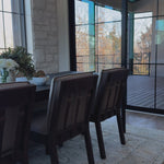 An Amethyst fave -- the Wilmington dining chair has a gorgeous coffee colored textile paired with medium toned wood and interesting leather buckles on the back -- we tied in the gold buckles with the gold chandelier above!  Inspired by the folded pillow form, the seat and back cushions of this parawood dining chair are covered in performance fabric. Amethyst Home provides interior design, new home construction design consulting, vintage area rugs, and lighting in the Omaha metro area.
