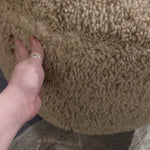 Place this round ottoman just about anywhere. Upholstered in a faux Mongolian shearling with a high pile fur in a toasty tan neutral hue. Burnt birch parawood legs add a touch of contrast.Overall Dimensions: 22.5"W x 22.5"L x 20.5"H Amethyst Home provides interior design, new home construction design consulting, vintage area rugs, and lighting in the Nashville metro area.