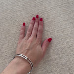 Trendy folded sides complement a comfortable bench-style seat of soft, cream-colored upholstery exclusive to Four Hands. Performance fabrics are specially created to withstand spills, stains, high traffic and wear, ensuring long-term comfort and unmatched durability. Amethyst Home provides interior design, new home construction design consulting, vintage area rugs, and lighting in the Kansas City metro area.