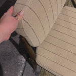 Modern materials place an updated twist on the traditional armless dining chair. Linen/cotton blend cushioning features a faint pinstripe for a unique-while-versatile look. Simply framed by brown oak.Overall Dimensions: 21.25"w x 24.25"d x 33.50"h Amethyst Home provides interior design, new home construction design consulting, vintage area rugs, and lighting in the Monterey metro area.