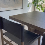 Solid parawood forms a simple, vintage-inspired frame for sling-style seating of chocolate top-grain leather. Amethyst Home provides interior design, new home construction design consulting, vintage area rugs, and lighting in the San Diego metro area.