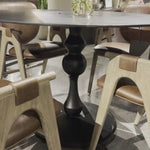 Finished in an antique black, raw aluminum shapes a bistro-style dining table with a turned, geometric look. Seats four comfortably. Amethyst Home provides interior design, new home construction design consulting, vintage area rugs, and lighting in the Winter Garden metro area.