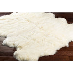Featuring Sheepskin Rug by Surya at Amethyst Home. Dreamy natural sheepskin rugs from Argentina.  Soft to the touch and a perfect element to layer in your most coveted spots.. Amethyst Home provides interior design, new construction, custom furniture, and area rugs in the Charlotte metro area
