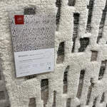 Dimensional yet soft, the Bennett Ivory / Charcoal Area Rug is hand-knotted of wool, viscose and polyester in India. Featuring a new carve like high-low pile, Bennett has an ivory base with abstract tonal designs. Plus, it's plush underfoot -- a great choice for your office, bedroom, or other medium traffic areas.   Hand Knotted 45% Wool | 32% Viscose | 17% Polyester | 6% Other Fibers Pile BEN-01 Ivory/Charcoal