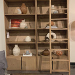 Five roomy shelves are ready to store favorite books and treasures, with smoked solid pine suited for any space. Removable ledges slant at an angle on each shelf, for even-better display of art and coffee table-size books, plus an optional slide ladder (for decorative use only) to complete the look.  Overall Dimensions: 35.50"w x 17.50"d x 98"h