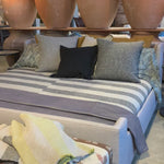 We love the maple wood base of this Laurel Bed by Cisco Brothers. A cozy, chic piece to add to your bedroom to immediately elevate the space. Photographed in Molino Blush. Amethyst Home provides interior design, new home construction design consulting, vintage area rugs, and lighting in the Winter Garden metro area.