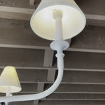 This Piaf Grande Chandelier from Visual Comfort has linen shades and brings a warm, classic look to any entry way, living room, or other large area.   Designer: Thomas O'Brien