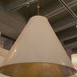 The Goodman Large Hanging Lamp by Visual Comfort gives us all the industrial and farmhouse vibes. Available in four different finishes, this looks gorgeous hanging over a kitchen island, sink, or other large area.  Designer: Thomas O'Brien