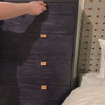 The toffee leather handles of this Trey 5 Drawer Dresser - Black Wash Poplar bring a classy pop of color and texture to the space. A stylish dresser of black-washed poplar offers plenty of bedroom storage space thanks to five spacious drawers.   Overall Dimensions: 36.00"w x 18.00"d x 49.00"h