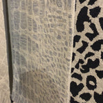 Hooked of 100% wool, this Masai Collection is a softer side of the savannah brought to life by artisans in India. Masai is a beautiful contemporary rug with contrasting hues and is a chic twist on the classic animal print.  Hooked 100% Wool MAS-02 Grey / Ivory