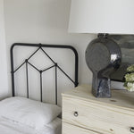 Vintage style for a classic bedroom look.  Durable, heavy iron makes for a supportive, wiggle-free bed. Amethyst Home provides interior design, new home construction design consulting, vintage area rugs, and lighting in the Nashville metro area.