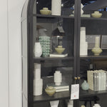 Store it in style with this Breya Cabinet in black. Made from black-finished iron, beautifully arched cabinetry features glass-front doors, ideal for storing and displaying favorite books, photos, keepsakes, and more. Amethyst Home provides interior design, new home construction design consulting, vintage area rugs, and lighting in the Washington metro area.