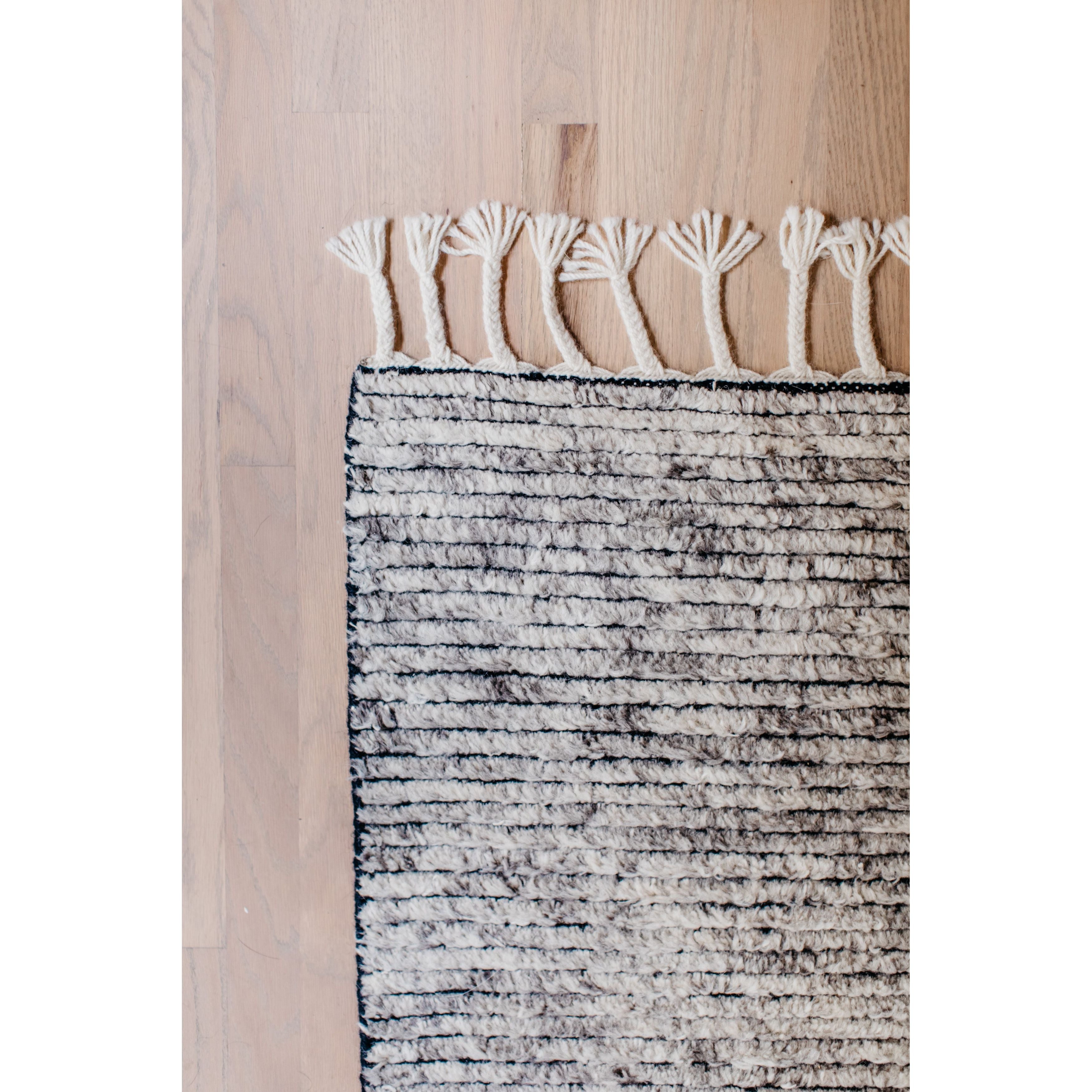 Featuring Alpine II Hand-Knotted Rug by Jaipur Living at Amethyst Home. Inspired by rugs from the Tullu region in Morocco, the Alpine II rug brings together heathered solids for a gorgeous rug. The hand-knotted 100% wool rug's high pile brings warmth and coziness to any living room or bedroom with soft colors of ivory and grey.
Hand-knotted100% WoolALP02Co.  Amethyst Home provides interior design, new home construction design consulting, vintage area rugs, and lighting in the San Diego metro area.