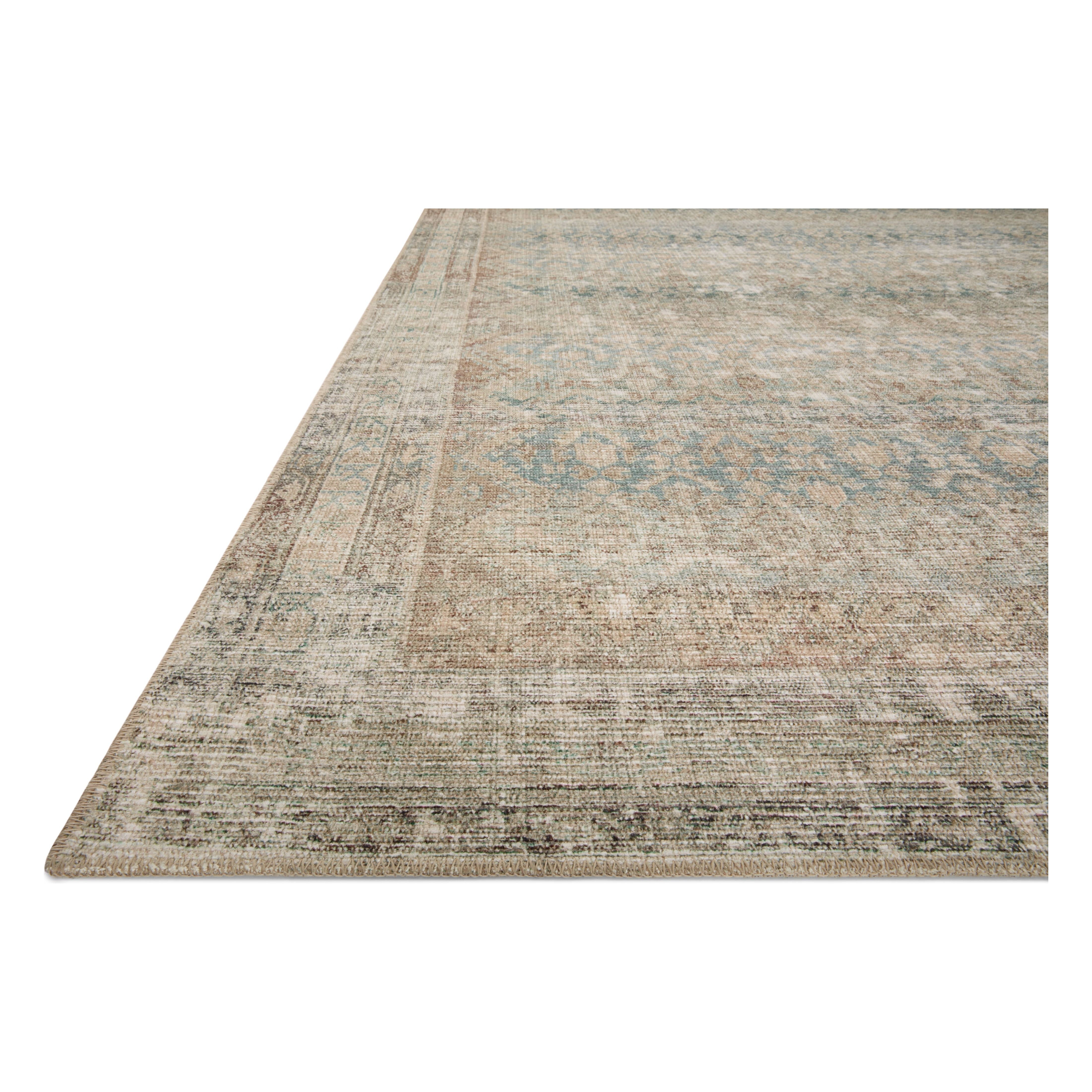 Featuring Angela Rose x Loloi Aubrey Jade / Natural Rug by Loloi at Amethyst Home. The Angela Rose x Loloi Aubrey Jade / Natural rug is the vintage-inspired area rug that makes visitors do double takes. The distressed pattern is printed with uncanny precision, while the ombre-fading and warm palette create an inviting, lived-in look. This is an incredibly versatile rug for busy living room. Amethyst Home provides interior design services, furniture, rugs, and lighting in the Des Moines metro area.