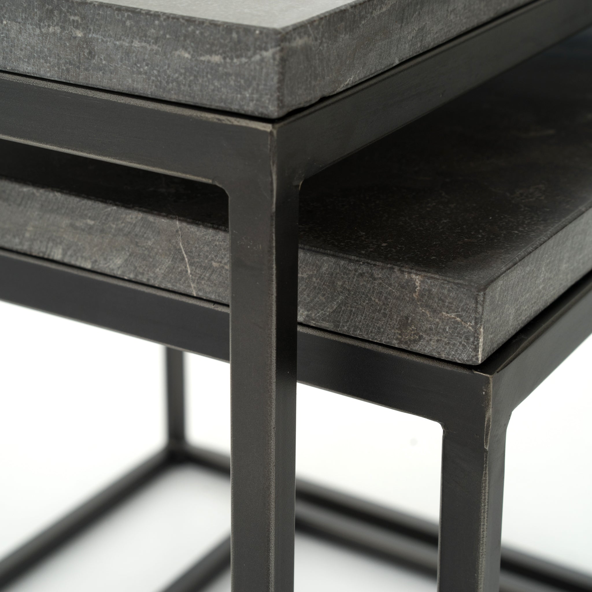 Featuring Harlow Nesting Tables - Set of 2 by Four Hands at Amethyst Home. Spare beauty, casual elegance. A gunmetal-finished Parsons base with hand-rubbed, dimensional edges supports two rough-hewn bluestone slabs that feel found and perfectly placed.
Dimensions: Large 20"W x 16"L x 19"H  ; Small 17"W x 13.5"L x 16"HColors: Gunmetal, BluestoneMaterials: Iro.  Amethyst Home provides interior design, new home construction design consulting, vintage area rugs, and lighting in the Austin metro area.