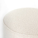 Featuring Sinclair Round Ottoman - Knoll Natural by Four Hands at Amethyst Home. This round ottoman of textural cream boucle can be placed just about anywhere, bringing with it a hip retro vibe.
Overall Dimensions: 22"W x 22"L x 18.50"HColors: Distressed Natural, Knoll NaturalMaterials: Solid Parawood, 95% Pl, 5% PcFabric: PerformanceWeight: 13.23 lbVolume: 5.  Amethyst Home provides interior design, new home construction design consulting, vintage area rugs, and lighting in the Boston metro area.