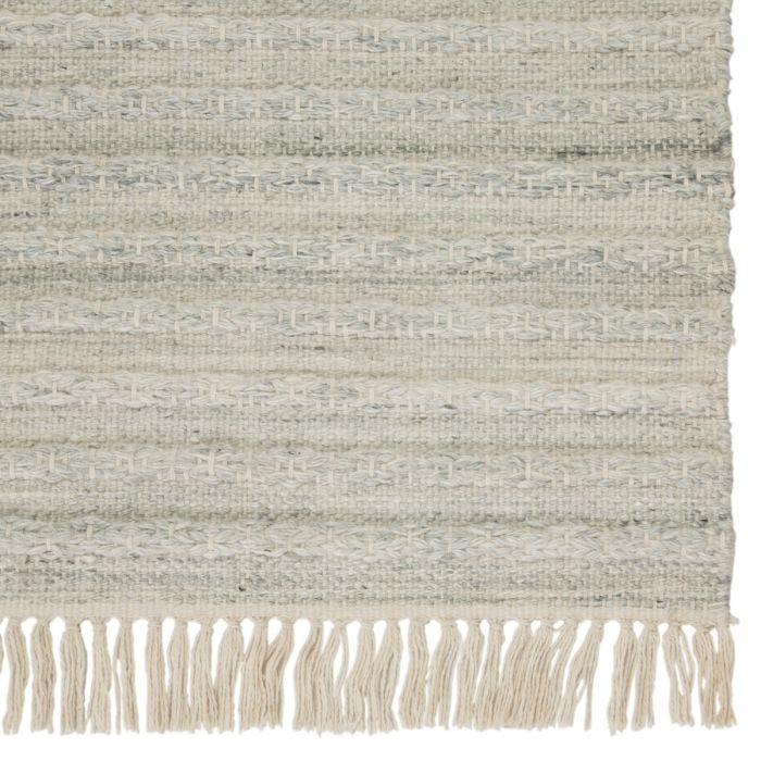 Featuring Castillo Torre Rug by Jaipur Living at Amethyst Home. The handwoven Castillo Torre rug features a soft feel and relaxed, versatile style. The Torre area rug showcases a blend of light gray and cream tones for a grounding, neutral look. Crafted of PET yarn or recycled plastic, this durable and textured rug brings warmth and inviting appeal to indoo.  Amethyst Home provides interior design, new home construction design consulting, vintage area rugs, and lighting in the Portland metro area.