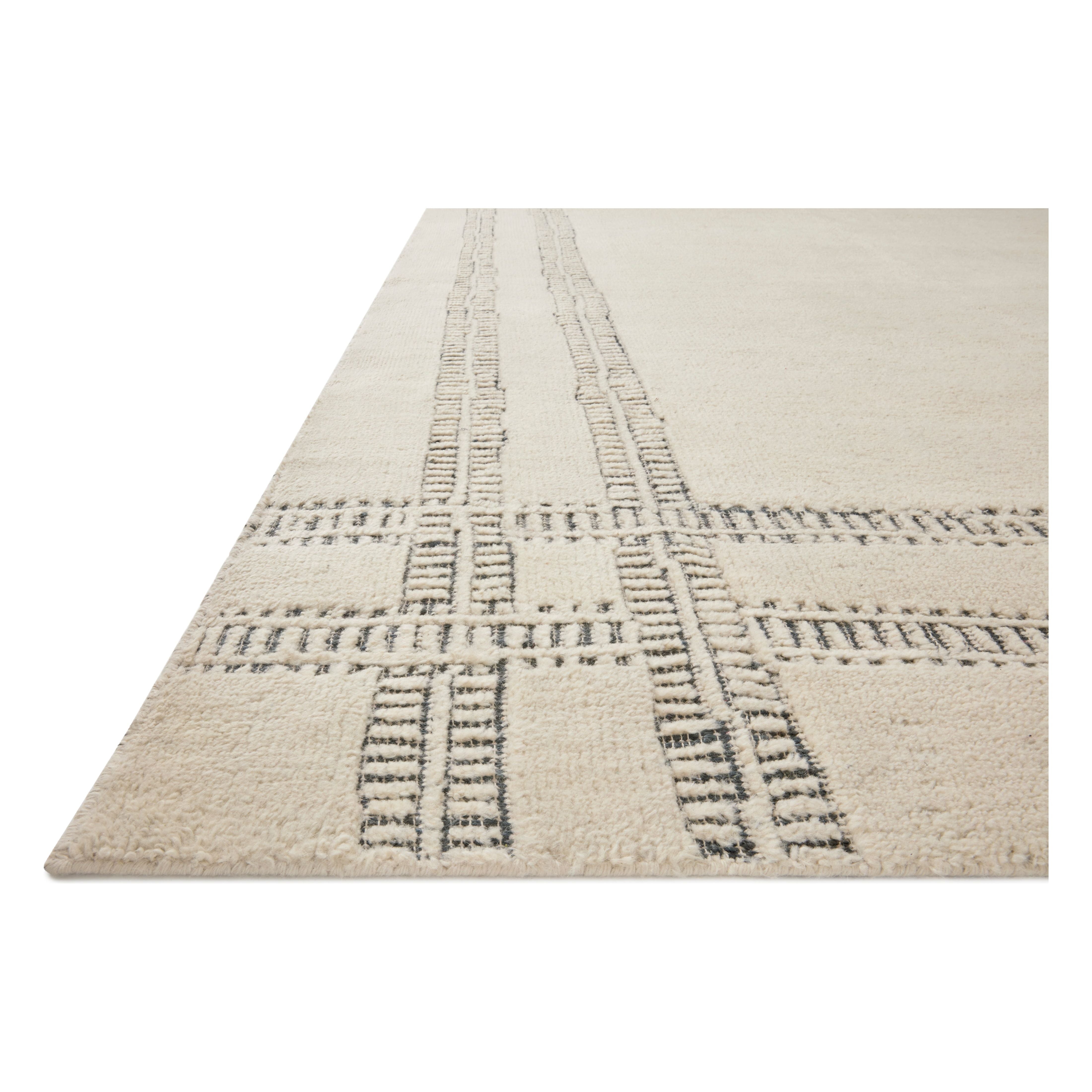 Featuring Carrier & Company x Loloi Milton Ivory / Ink Rug by Loloi at Amethyst Home. Carrier & Company x Loloi Milton Ivory / Ink Rug uses a banding detail to express the rich and plush pile. The addition of jute to the wool and cotton rugs creates a luxurious density that can be both seen and felt. As a simple border detail, a graphic plaid, or an over-scale.  Amethyst Home provides interior design, new home construction design consulting, vintage area rugs, and lighting in the Omaha metro area.