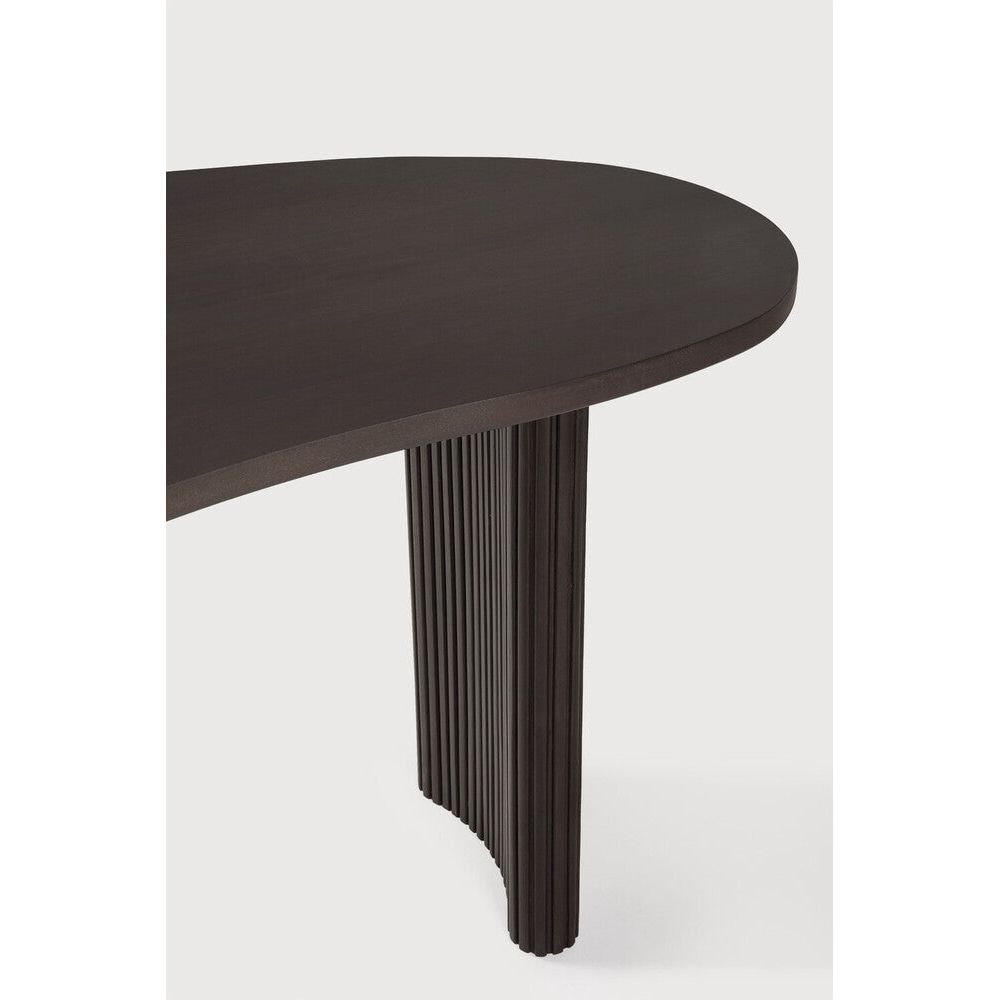 Featuring Boomerang Mahogany Dark Brown Desk by Ethnicraft at Amethyst Home. Inspired by shapes found in nature, the Boomerang collection features a playful, pebble top set on curved legs with a stacked, wood stick effect. The Boomerang desk is a statement piece for any workspace with its organic, eye-catching design unique for the office.
Dimensions: 33". Amethyst Home provides interior design, new home construction design consulting, vintage area rugs, and lighting in the Los Angeles metro area.