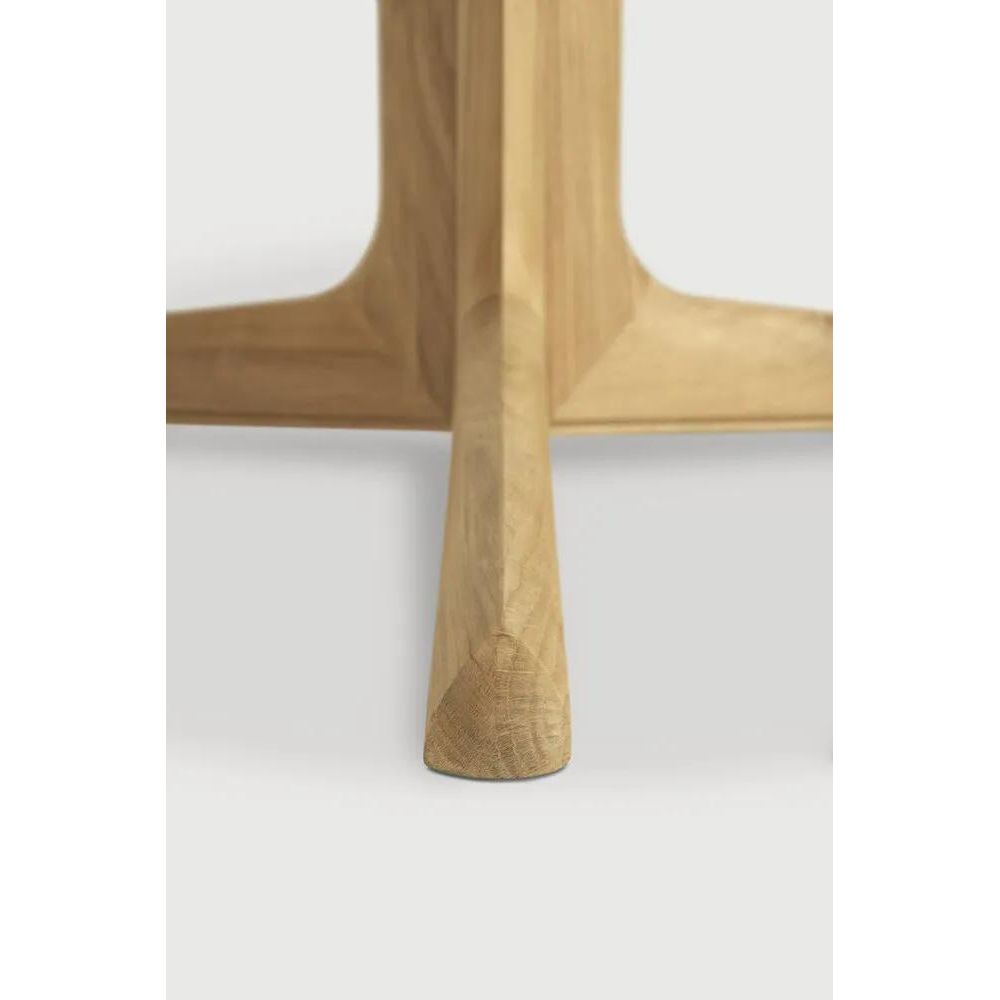 Featuring Corto Dining Table by Ethnicraft at Amethyst Home. Inspired by the vaults within grand architectural designs, the Corto's central-footed base provides both visual interest and practical stability with less leg disturbance for your guests. The solid oak tabletop is crafted into the perfect shape, with unique rounded corners to create welcoming and. Amethyst Home provides interior design, new home construction design consulting, vintage area rugs, and lighting in the Des Moines metro area.