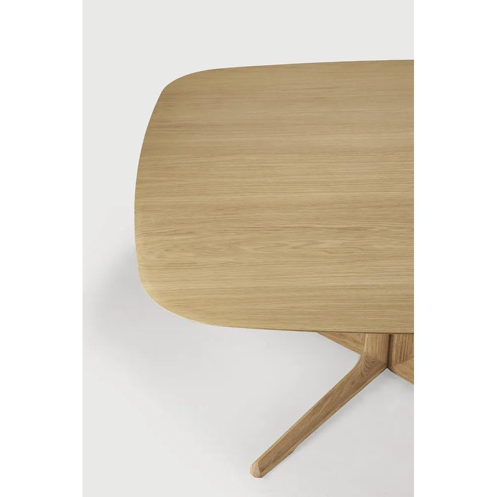 Featuring Corto Dining Table by Ethnicraft at Amethyst Home. Inspired by the vaults within grand architectural designs, the Corto's central-footed base provides both visual interest and practical stability with less leg disturbance for your guests. The solid oak tabletop is crafted into the perfect shape, with unique rounded corners to create welcoming . Amethyst Home provides interior design, new home construction design consulting, vintage area rugs, and lighting in the Winter Garden metro area.