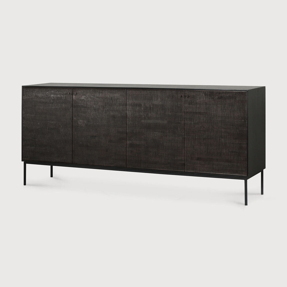 Featuring Grooves Sideboard Teak Black by Ethnicraft at Amethyst Home. The Grooves sideboard is soulful to say the least. Every single line you see is hand carved, making each piece truly unique. Small imperfections are part of the story, even more so: they enhance Grooves' character. The result is a slightly different surface every time, each with its own rhy. Amethyst Home provides interior design, new home construction design consulting, vintage area rugs, and lighting in the Boston metro area.