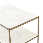 Featuring Felix Nightstand - Antique Brass by Four Hands at Amethyst Home. Add a pop of sophistication to any space. Classic white marble lays three tiers of smooth shelving for plenty of space, while antique brass-finished iron framing places a feminine spin on bedside storage.
Overall Dimensions: 25"W x 18"L x 26"H
Colors: Antique Brass, Polished White Marb.  Amethyst Home provides interior design, new home construction design consulting, vintage area rugs, and lighting in the Boston metro area.