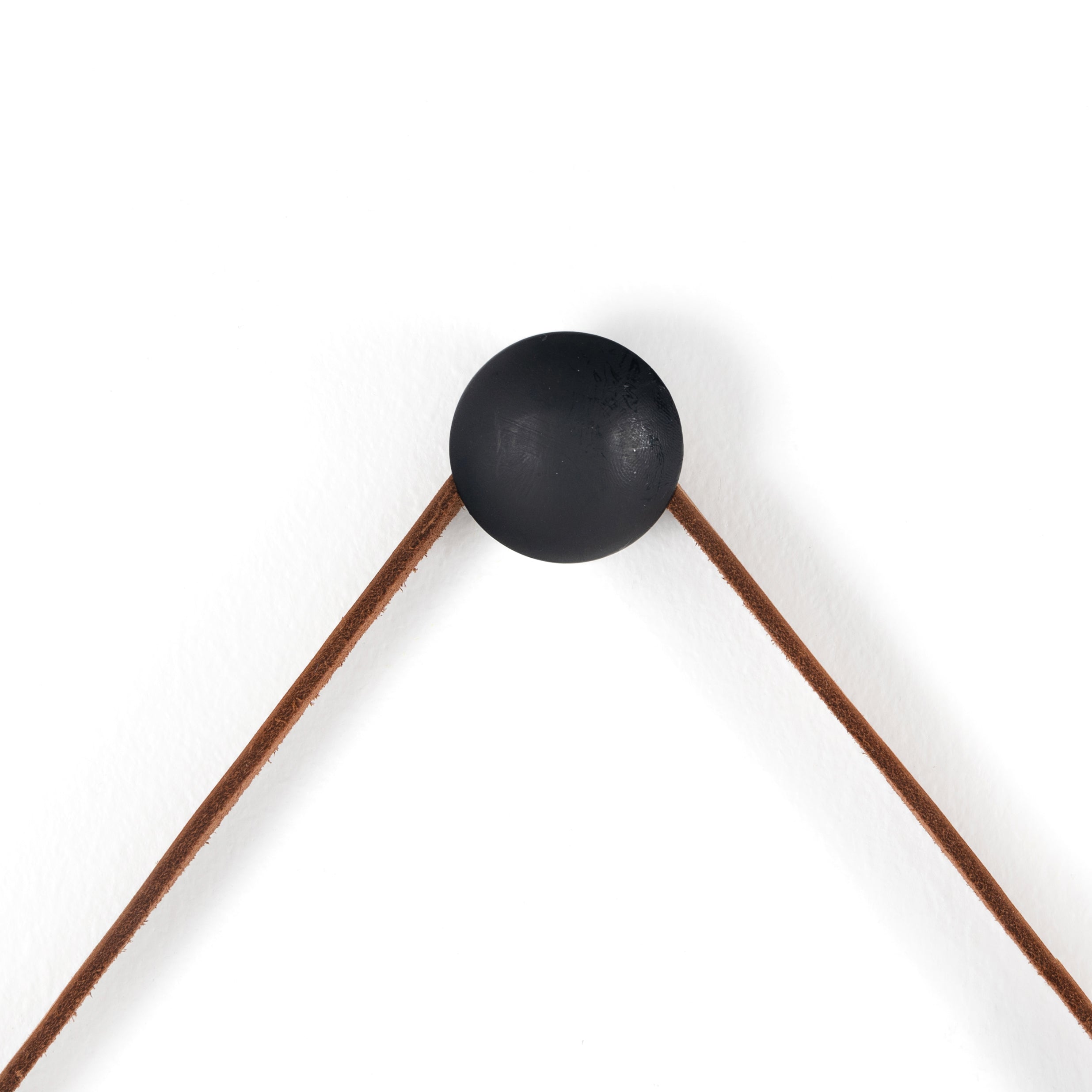 Featuring Des Mirror by Four Hands at Amethyst Home. The Des Mirror is hung by a handsome, toffee-colored top grain leather strap. We love the fresh take on what would otherwise be a traditional, round mirror. The mirror is framed in black-washed popular and would like amazing hung in an entryway, bedroom, or other space. 
Overall Dimensions: 30"W x 1.50"L .  Amethyst Home provides interior design, new home construction design consulting, vintage area rugs, and lighting in the Portland metro area.