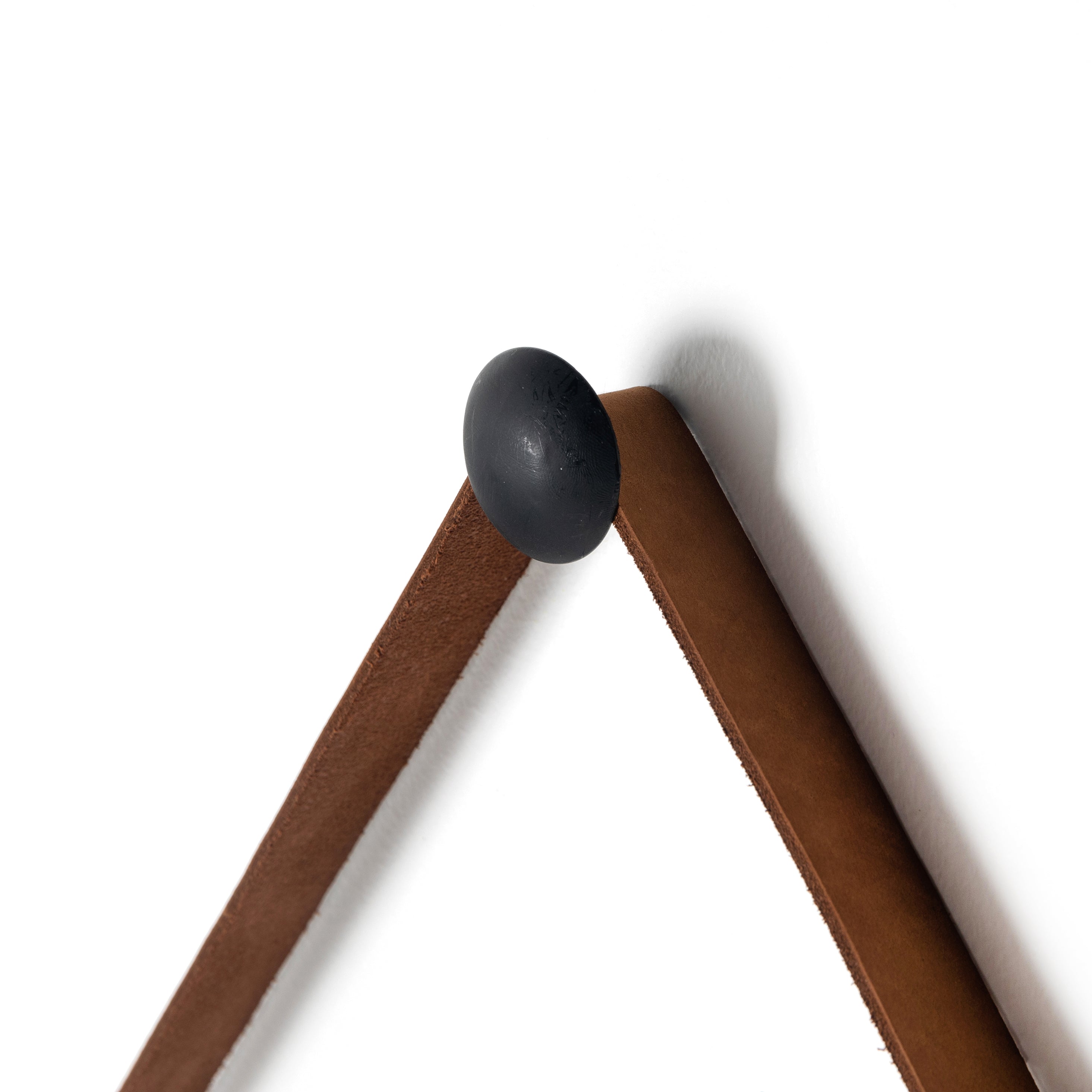 Featuring Des Mirror by Four Hands at Amethyst Home. The Des Mirror is hung by a handsome, toffee-colored top grain leather strap. We love the fresh take on what would otherwise be a traditional, round mirror. The mirror is framed in black-washed popular and would like amazing hung in an entryway, bedroom, or other space. 
Overall Dimensions: 30"W x 1.50"L x .  Amethyst Home provides interior design, new home construction design consulting, vintage area rugs, and lighting in the Austin metro area.