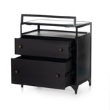 Featuring Shadow Box Nightstand by Four Hands at Amethyst Home. This Shadow Box Nightstand is finished in a gorgeous matte black. We love that the glass top allows you to showcase your favorite jewelry or family keepsake, while the two spacious drawers give you storage space. The knobs are finished in bronze to give this piece a sleek contrast. 
Overall Dime.  Amethyst Home provides interior design, new home construction design consulting, vintage area rugs, and lighting in the Houston metro area.