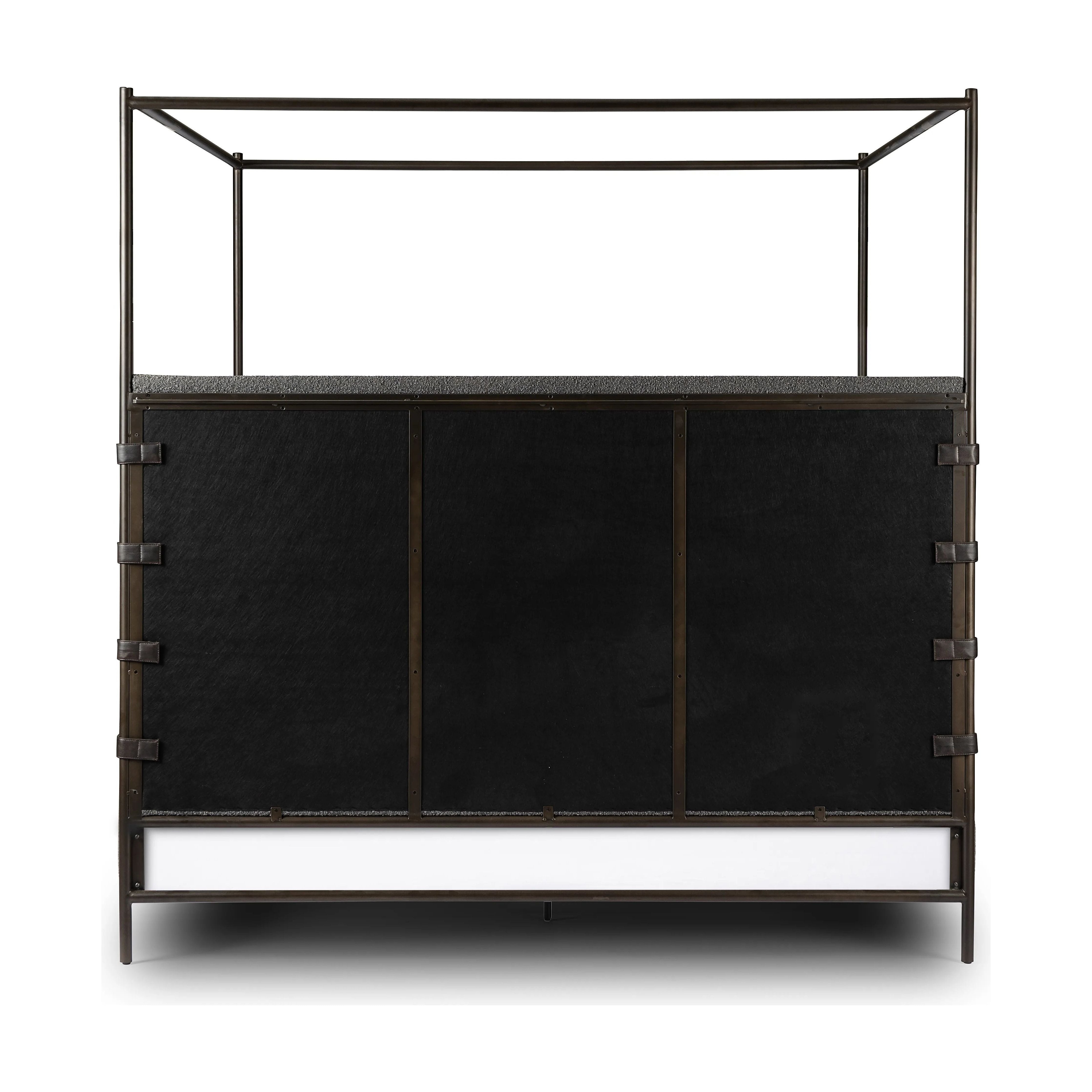 Featuring Anderson Knoll Charcoal-King Canopy Bed by Four Hands at Amethyst Home. Bring texture into play. This iron canopy bed features a headboard upholstered in a classic boucle fabric with decorative leather straps for a material-driven contrast. Standard box spring required. This bed is not compatible with an adjustable mattress.Overall Dimensions: 85". Amethyst Home provides interior design, new home construction design consulting, vintage area rugs, and lighting in the Nashville metro area.