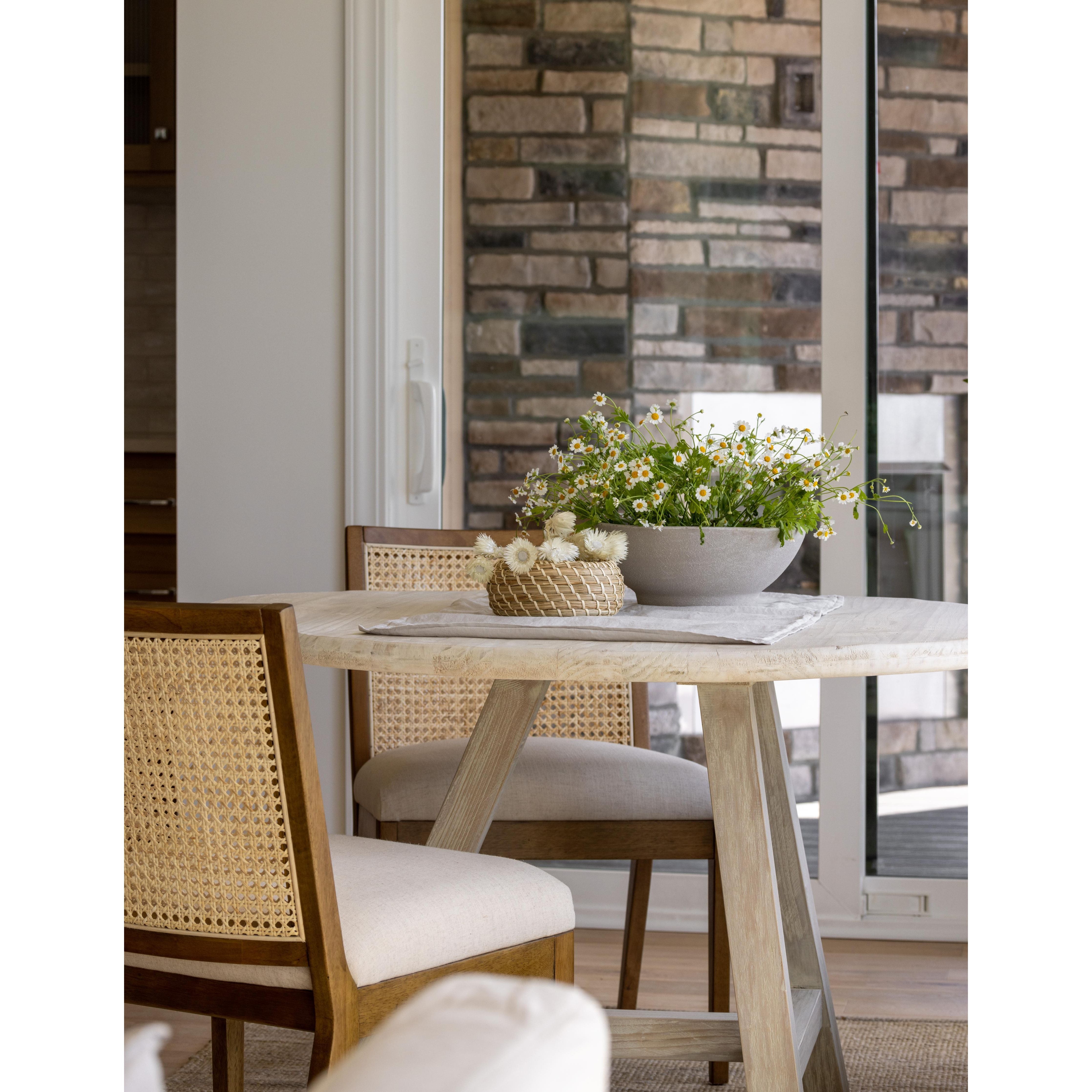 Featuring Charlotte Armless Dining Chair - Cane Toasted Nettlewood by Four Hands at Amethyst Home. Coastal aesthetic and daily comfort -- the Charlotte Dining Chair is an Amethyst fave.  It's perfect for blending wood tones in a space due to the two tone cane back.  Upholstered in a performance fabric for stress-free daily use.
Overall Dimensions: 22.50".  Amethyst Home provides interior design, new home construction design consulting, vintage area rugs, and lighting in the Los Angeles metro area.