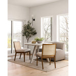 Featuring Charlotte Armless Dining Chair - Cane Toasted Nettlewood by Four Hands at Amethyst Home. Coastal aesthetic and daily comfort -- the Charlotte Dining Chair is an Amethyst fave.  It's perfect for blending wood tones in a space due to the two tone cane back.  Upholstered in a performance fabric for stress-free daily use.
Overall Dimensions: 22.50"W x .  Amethyst Home provides interior design, new home construction design consulting, vintage area rugs, and lighting in the Houston metro area.