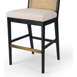 Featuring Antonia  Armless Dining Stool Stool by Four Hands at Amethyst Home. Light-toasted parawood frames a textural inlay of natural cane for a clean, monochromatic look, with seating of performance fabric for smart sensibility. Perfectly sized for the counter, with a brass kick plate for comfort and contrast. Performance fabrics are specially created to withstand spills, stai. Amethyst Home provides interior design, new construction, custom furniture, and area rugs in the Calabasas metro area.