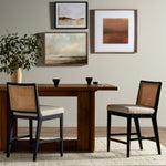 Featuring Antonia  Armless Dining Stool Stool by Four Hands at Amethyst Home. Light-toasted parawood frames a textural inlay of natural cane for a clean, monochromatic look, with seating of performance fabric for smart sensibility. Perfectly sized for the counter, with a brass kick plate for comfort and contrast. Performance fabrics are specially created to withstand spills, stai. Amethyst Home provides interior design, new construction, custom furniture, and area rugs in the Charlotte metro area.