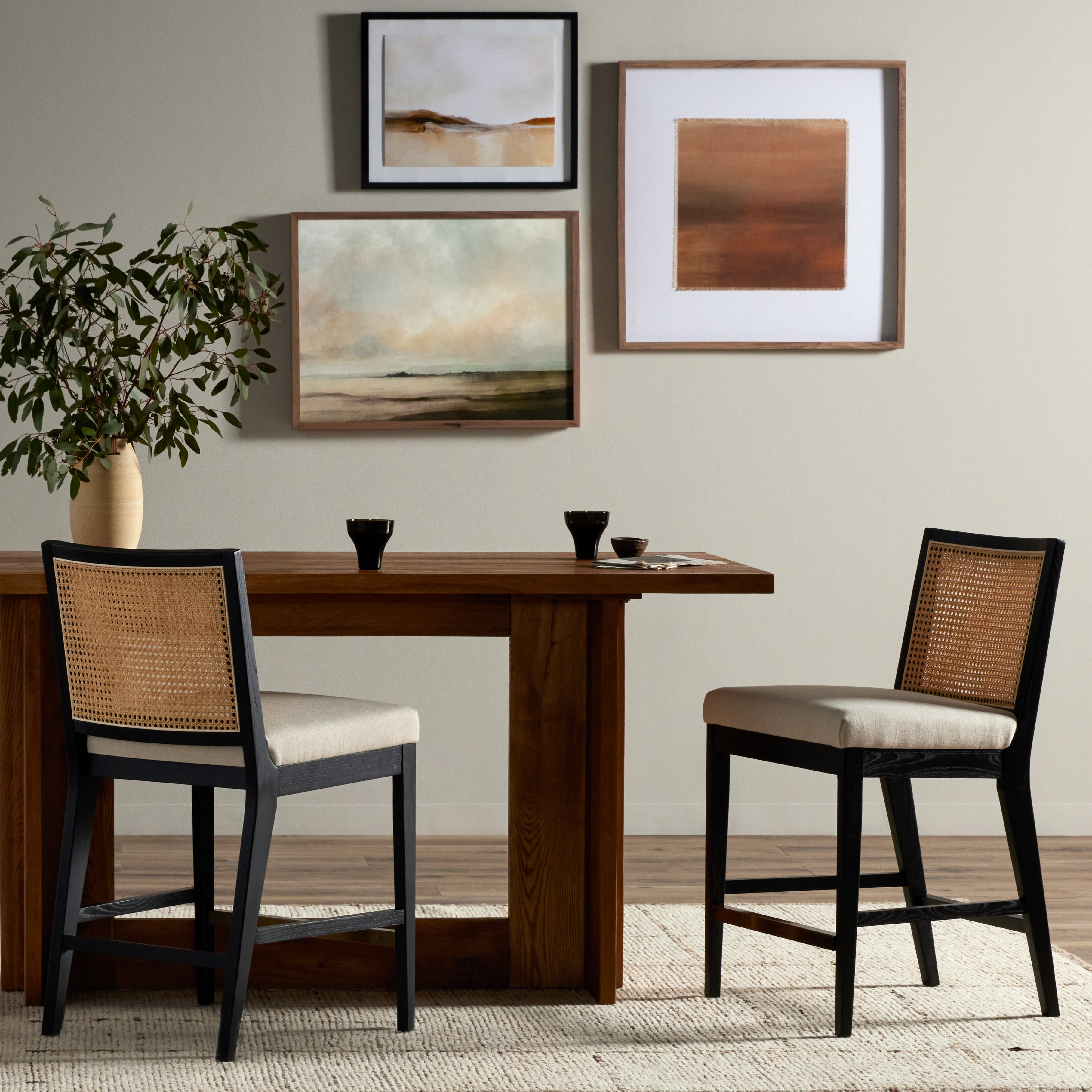 Featuring Antonia  Armless Dining Stool Stool by Four Hands at Amethyst Home. Light-toasted parawood frames a textural inlay of natural cane for a clean, monochromatic look, with seating of performance fabric for smart sensibility. Perfectly sized for the counter, with a brass kick plate for comfort and contrast. Performance fabrics are specially created to withstand spills, sta. Amethyst Home provides interior design, new construction, custom furniture, and area rugs in the Des Moines metro area.