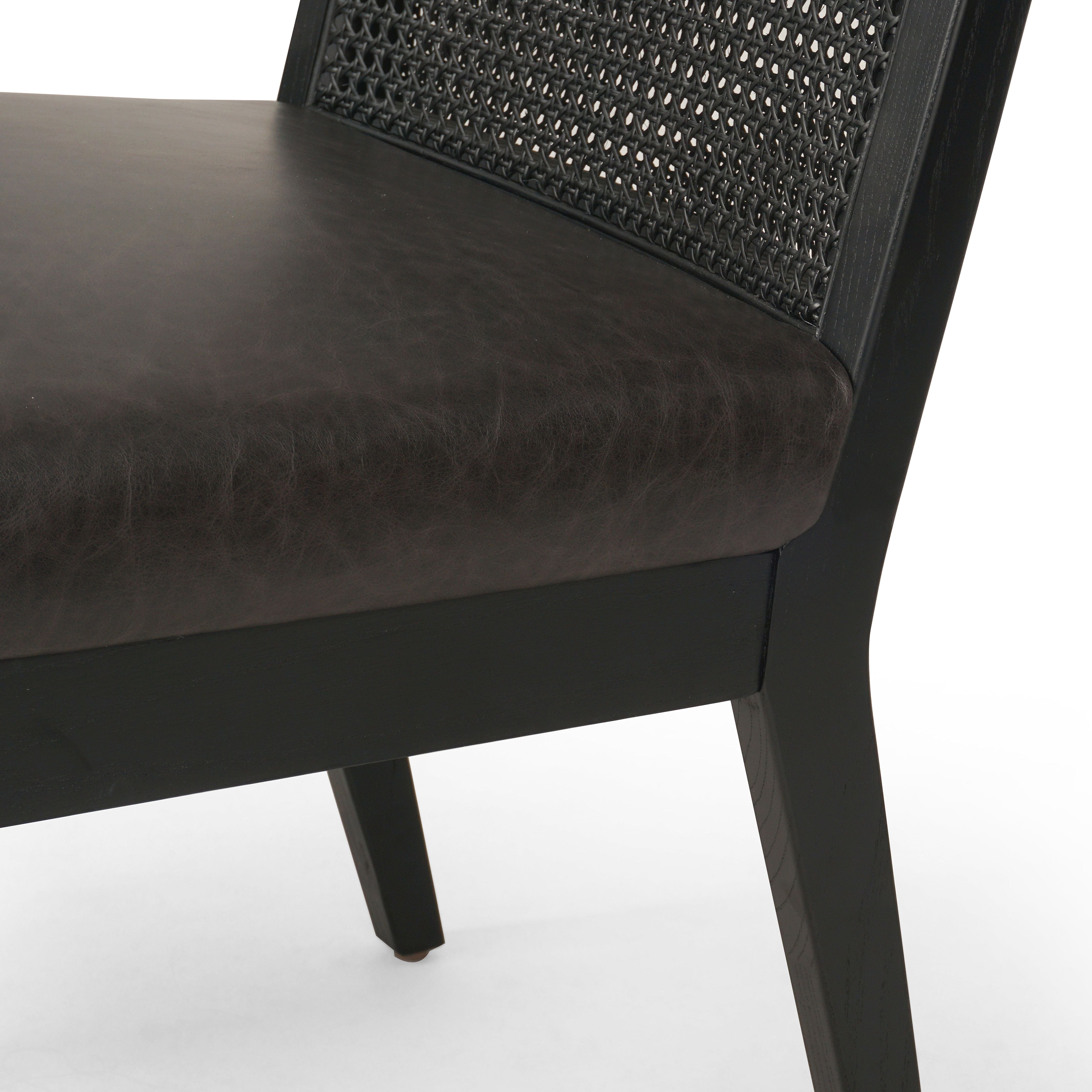 Featuring Antonia Black Armless Dining Chair by Four Hands at Amethyst Home. Mixed materials refresh a retro style. Brushed ebony cane frames top-grain leather seating with slight distressing, bringing more character to the seat.
Collection: KestonColors: Brushed Ebony Cane ,Brushed Ebony ,Sonoma BlackMaterials: Cane ,Solid Nettlewood ,Top Grain LeatherOverall Dimensions: 22.25". Amethyst Home provides interior design, new construction, custom furniture, and area rugs in the Des Moines metro area.