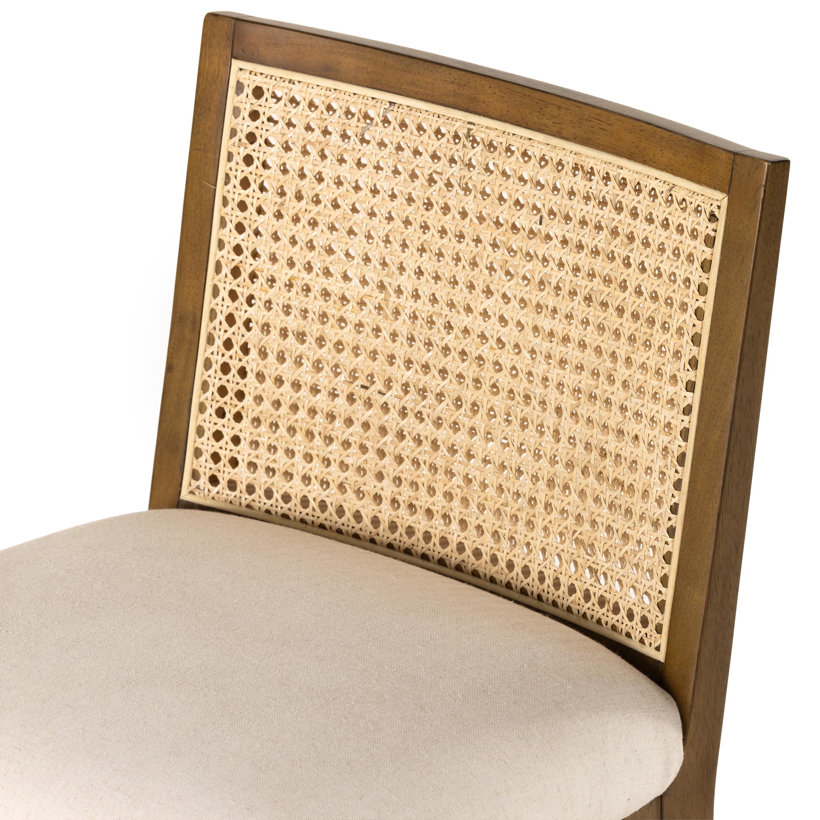 Featuring Antonia Solid Parawood Cane Armless Stool by Four Hands at Amethyst Home. Mixed materials refresh retro stool seating. Light-toasted nettlewood frames a textural inlay of natural cane for a clean, monochromatic look, with a light, linen-blend seat of high-performance fabric brings smart sensibility to bar-style seating. Performance fabrics are spec. Amethyst Home provides interior design, new home construction design consulting, vintage area rugs, and lighting in the Portland metro area.