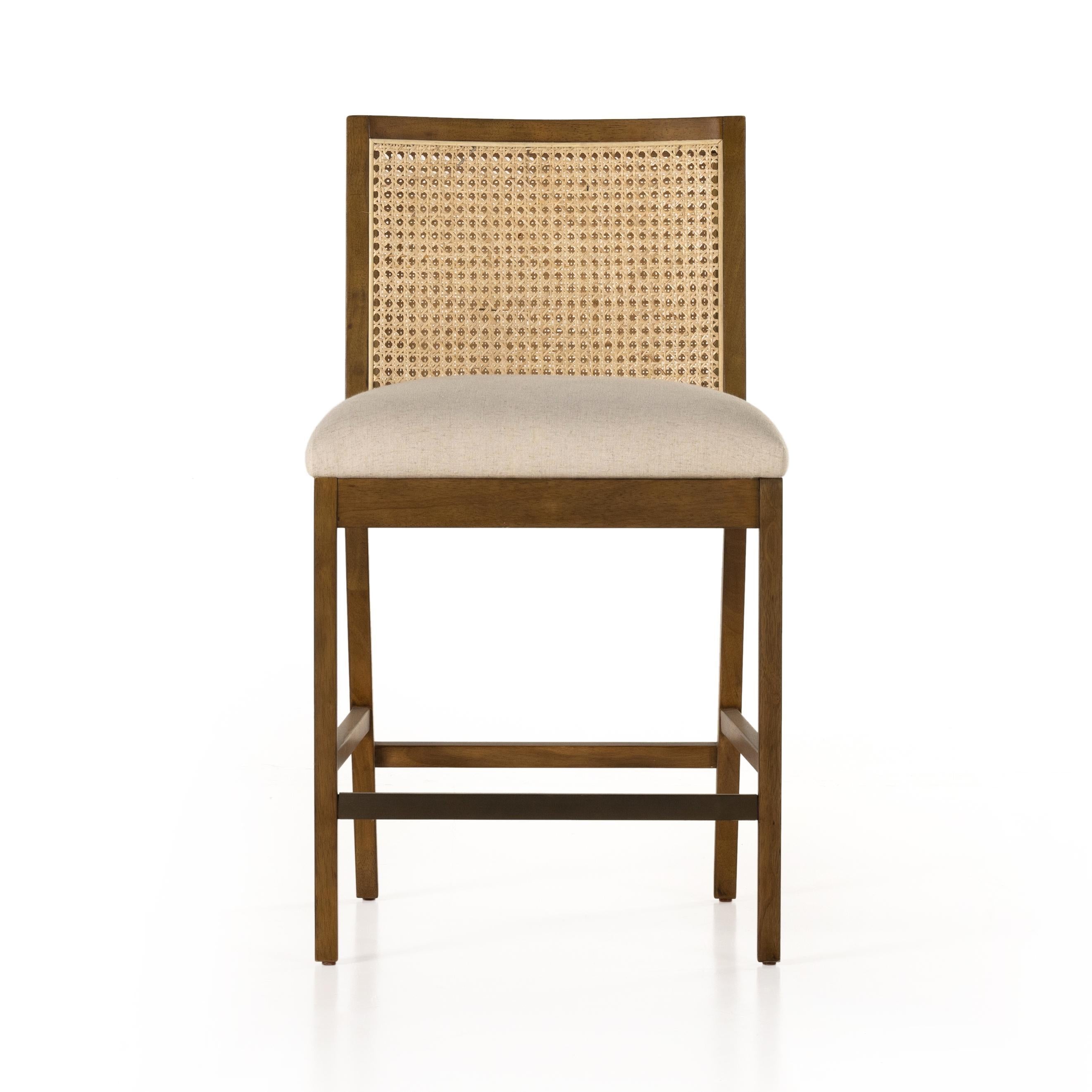 Featuring Antonia Solid Parawood Cane Armless Stool by Four Hands at Amethyst Home. Mixed materials refresh retro stool seating. Light-toasted nettlewood frames a textural inlay of natural cane for a clean, monochromatic look, with a light, linen-blend seat of high-performance fabric brings smart sensibility to bar-style seating. Performance fabrics are speci. Amethyst Home provides interior design, new home construction design consulting, vintage area rugs, and lighting in the Seattle metro area.