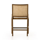 Featuring Antonia Solid Parawood Cane Armless Stool by Four Hands at Amethyst Home. Mixed materials refresh retro stool seating. Light-toasted nettlewood frames a textural inlay of natural cane for a clean, monochromatic look, with a light, linen-blend seat of high-performance fabric brings smart sensibility to bar-style seating. Performance fabrics are special. Amethyst Home provides interior design, new home construction design consulting, vintage area rugs, and lighting in the Tampa metro area.