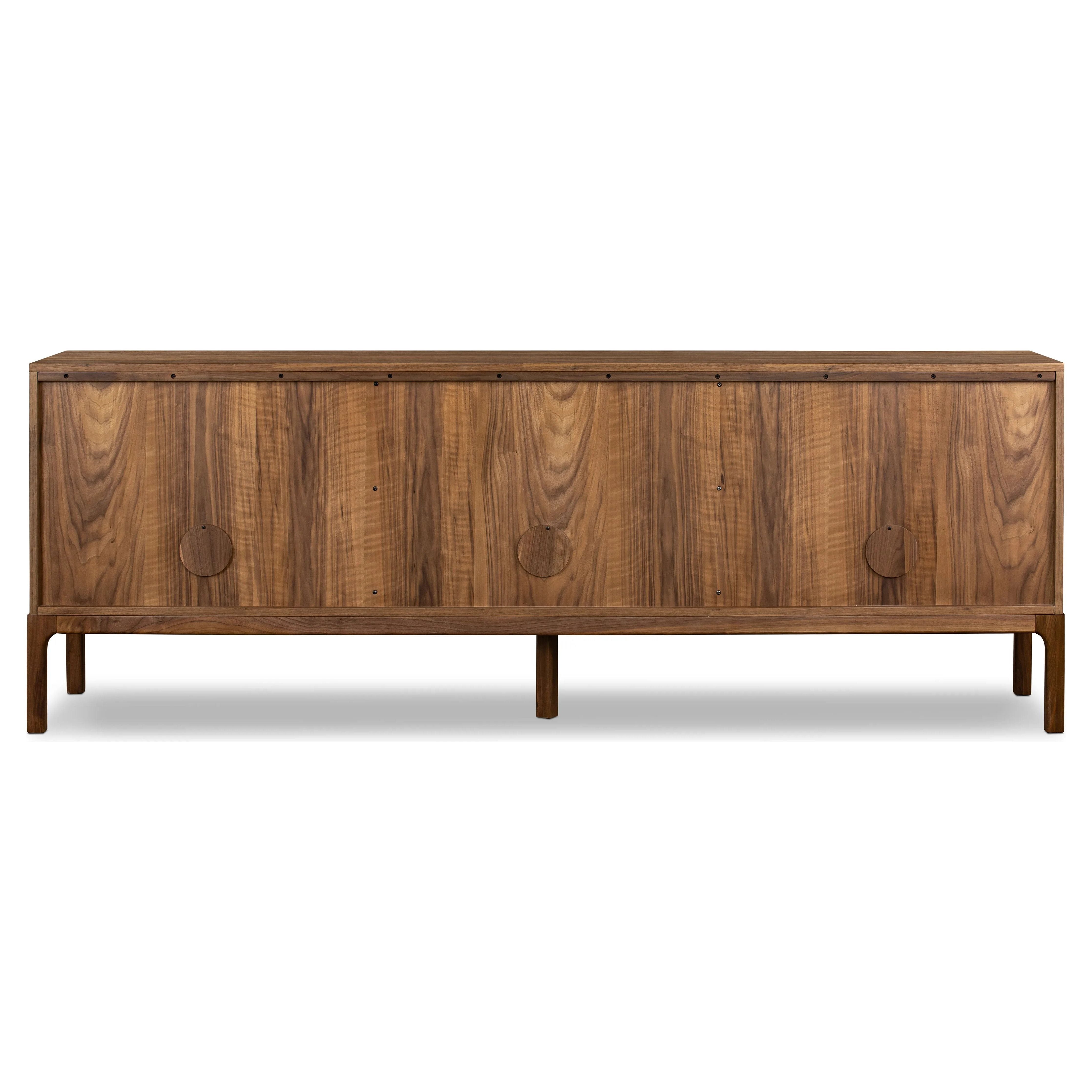 Featuring Arturo Natural Walnut Sideboard by Four Hands at Amethyst Home. Inspired by campaign-style furniture of the 1800s — packable pieces first designed for traveling military use — a simply shaped sideboard of natural walnut features a subtly inset top and rounded legs, finished with wooden hardware.
Collection: WallisColors: Natural Walnut Veneer ,Na. Amethyst Home provides interior design, new home construction design consulting, vintage area rugs, and lighting in the Boston metro area.
