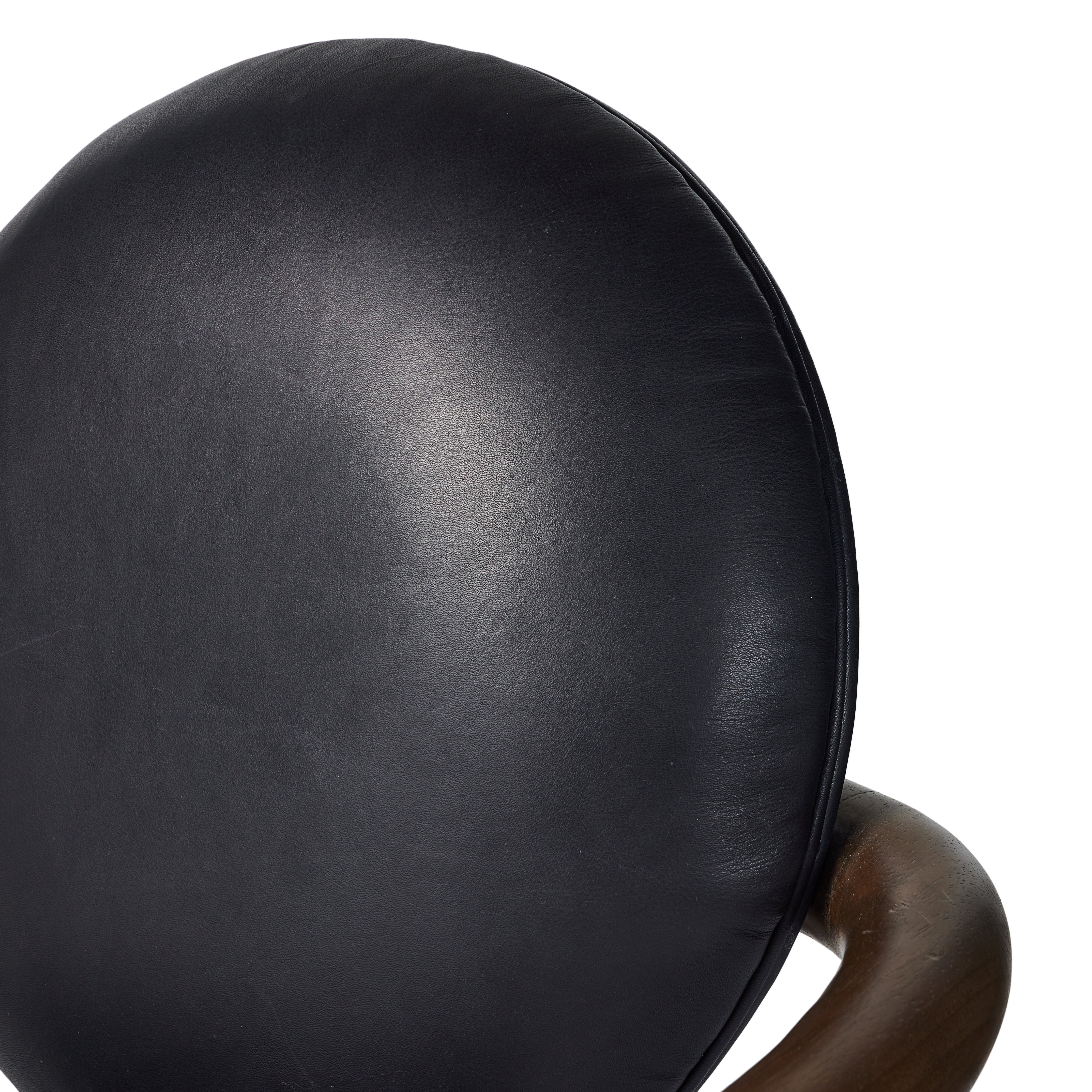 Featuring Bria Heirloom Black Chair by Four Hands at Amethyst Home. A playful take on Italian modernism. Solid parawood crafts a slim, curved frame and rear mock-tripod. Upholstered in black top-grain leather. Sourced from one of the oldest family-owned tanneries in Italy’s Bassano del Grappa, our heirloom leather covering is salvaged and processed from upc. Amethyst Home provides interior design, new home construction design consulting, vintage area rugs, and lighting in the San Diego metro area.