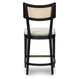 Featuring Britt Brushed Ebony with Savile Flax Stool by Four Hands at Amethyst Home. Mixed materials refresh retro styling. Brushed ebony nettlewood frames a textural inlay of natural cane for beautifully crisp contrast. Fastened by Velcro, light, linen-blend seating of high-performance fabric brings modern sensibility to the counter. Performance fabrics are s. Amethyst Home provides interior design, new home construction design consulting, vintage area rugs, and lighting in the Austin metro area.